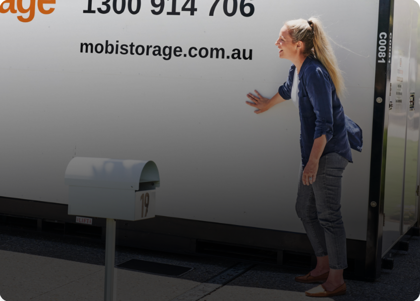 women standing in front of mobistorage container